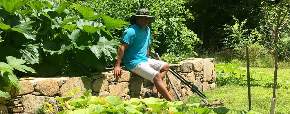 Rocky Johnson taking a break in a micro-farm